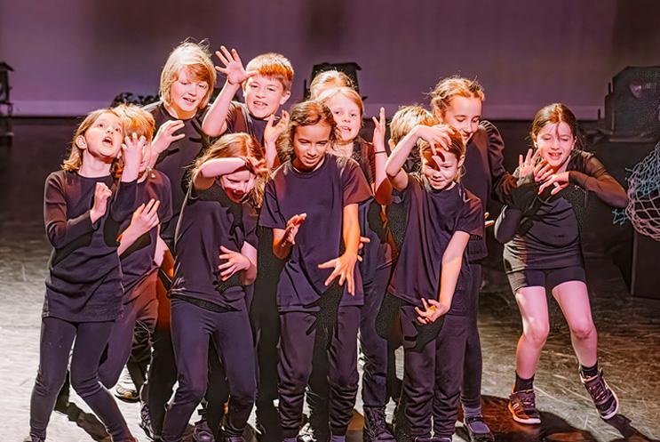 Young performers on stage.
