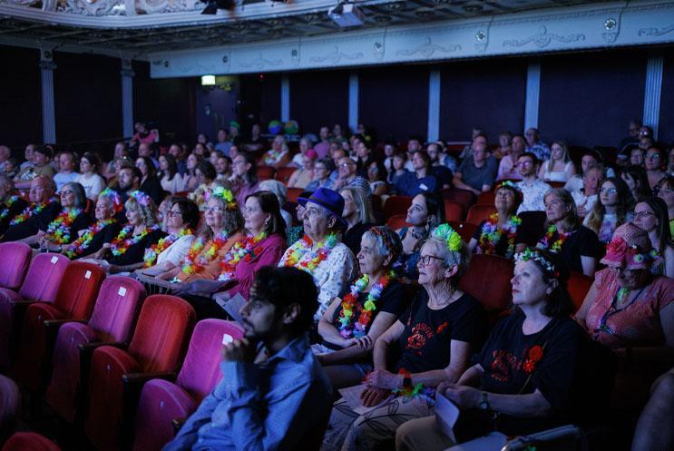 Audiences in the auditorium of Theatre Royal Winchester
