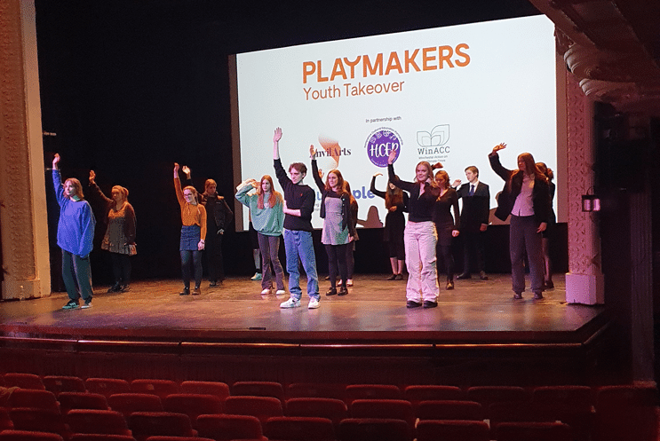 Young people rehearsing on stage
