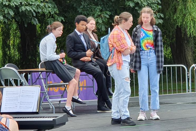 young performers on stage outdoors