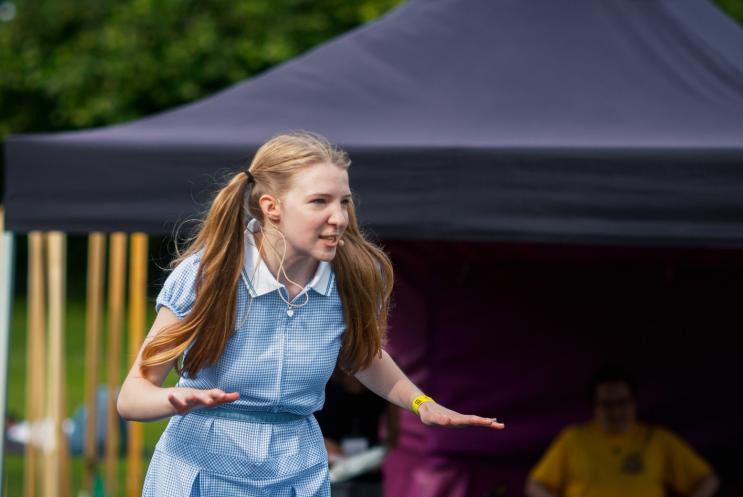 performer dressed as school girl