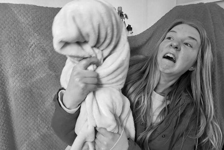 performer looking scared of blanket