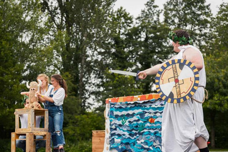 Young performers on stage outdoors