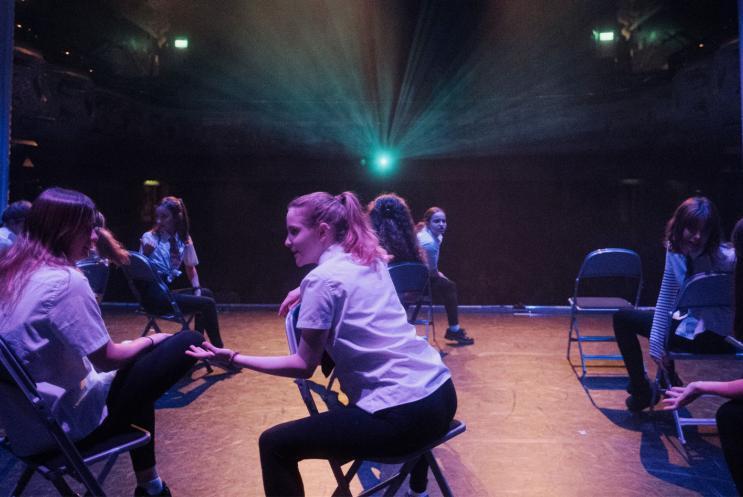 A group of young people performing on stage